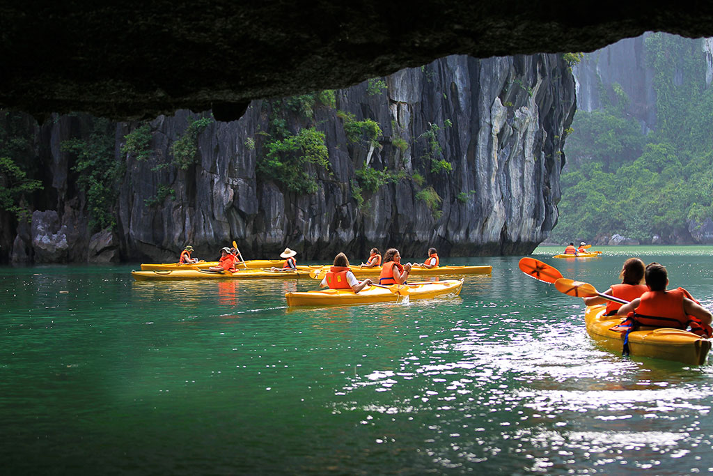 Kayaking through limestone karsts in Ha Long Bay