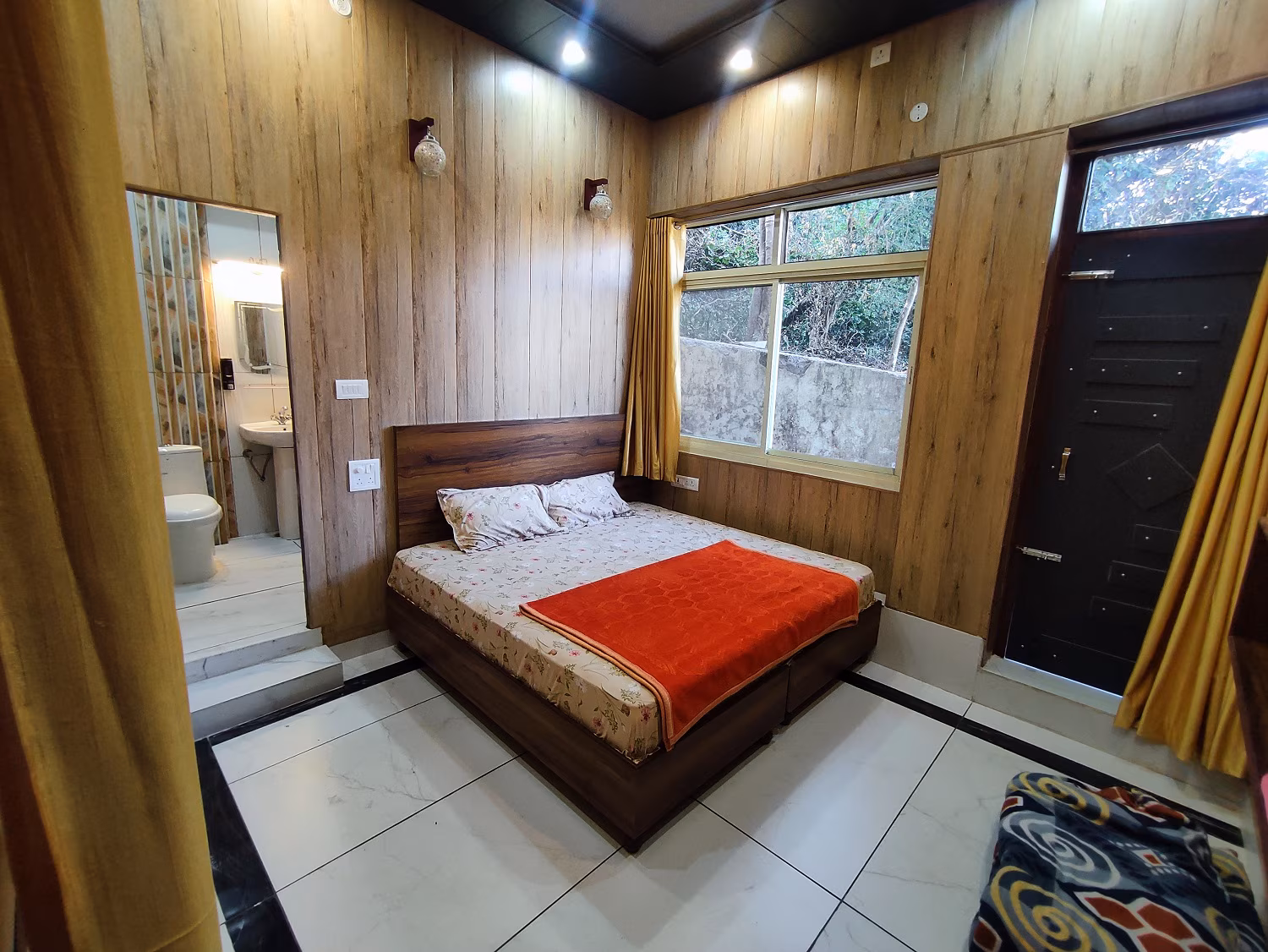 Simple ashram room and courtyard in Rishikesh