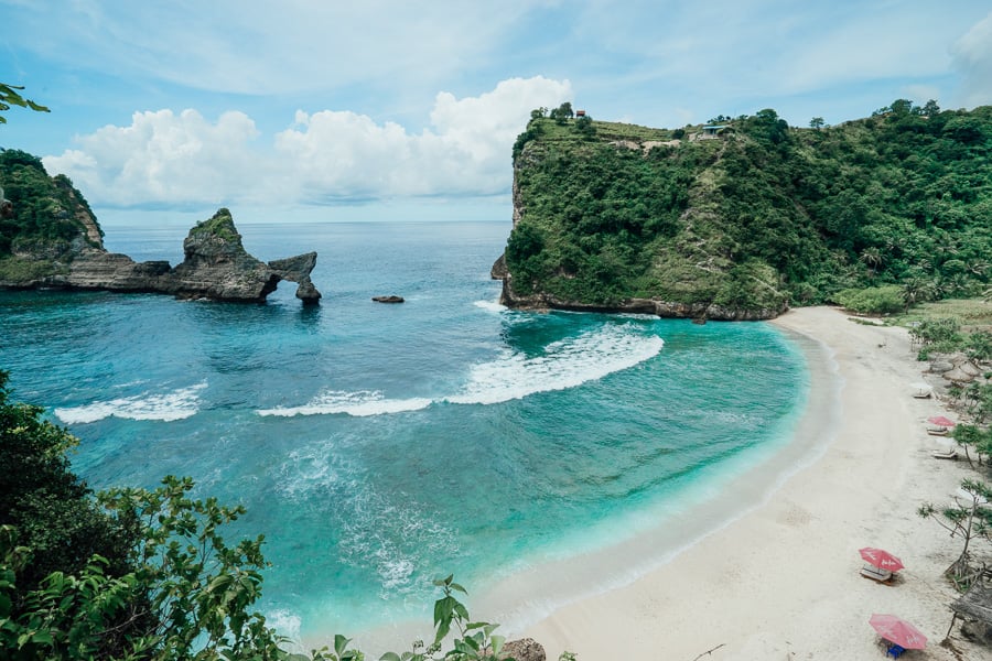 Dramatic limestone cliffs surrounding Atuh Beach Nusa Penida