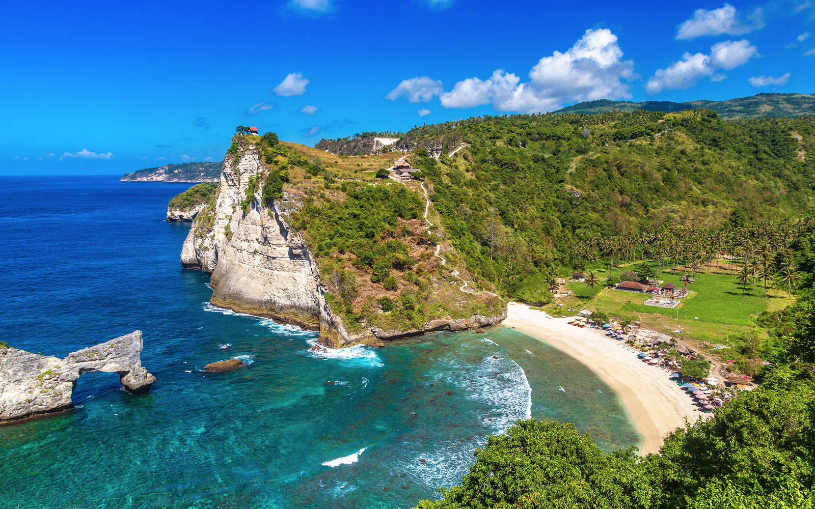 Atuh Beach with dramatic limestone cliffs in Nusa Penida