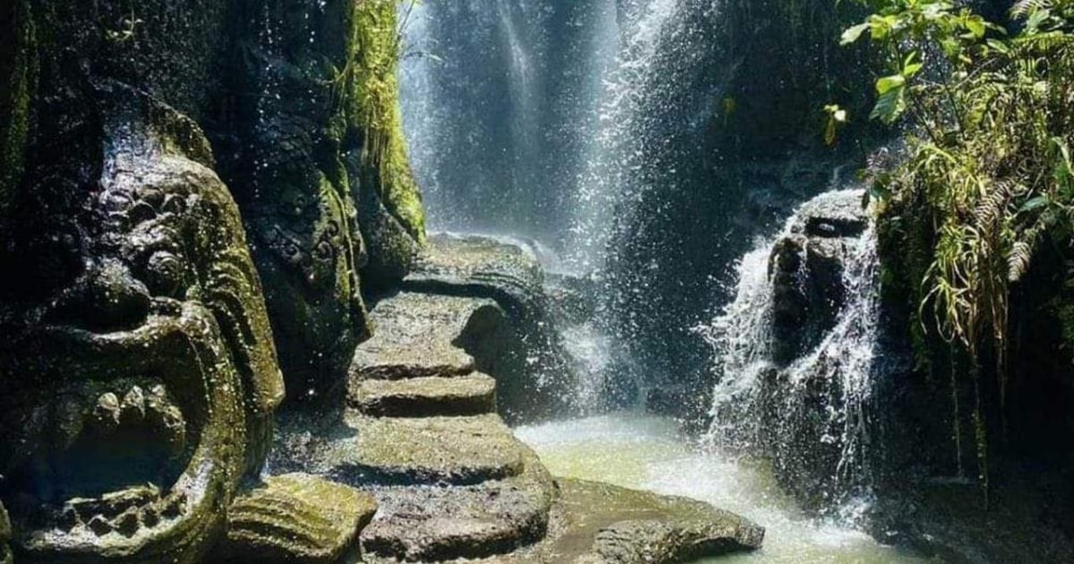 Beji Griya Waterfall surrounded by tropical greenery in Bali