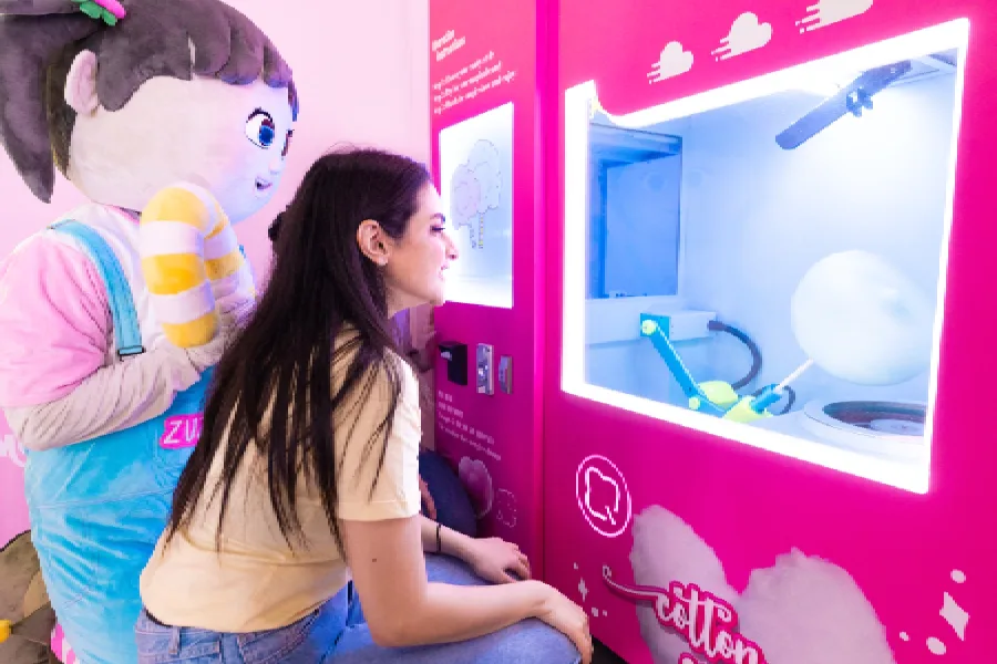 Ticket counter at Candy Museum Dubai with colorful pricing board