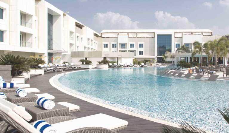 Luxury casino resort with pool and beach views in Daman