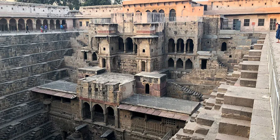 Close-up view of ancient architecture and carvings at Chand Baori
