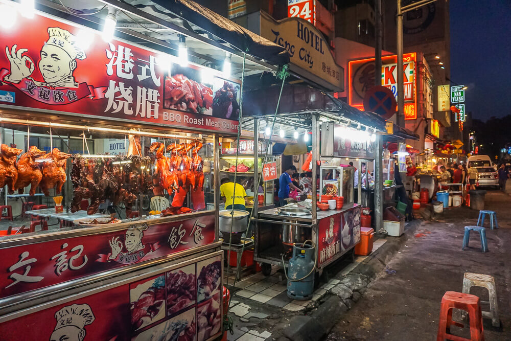 Street food stalls in Chinatown Kuala Lumpur serving local Malaysian cuisine