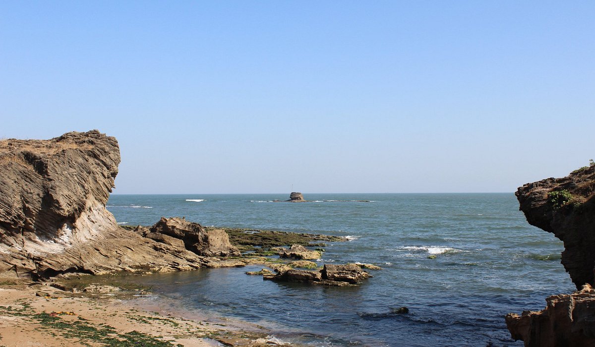 Coastal view of Diu with beach and fort skyline