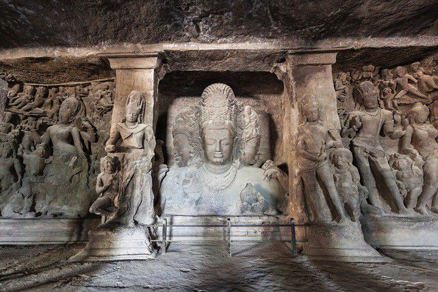 Iconic Trimurti sculpture panel inside Elephanta Caves