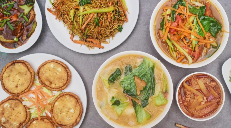 Traditional Sikkim food spread with dumplings, soup and local sides