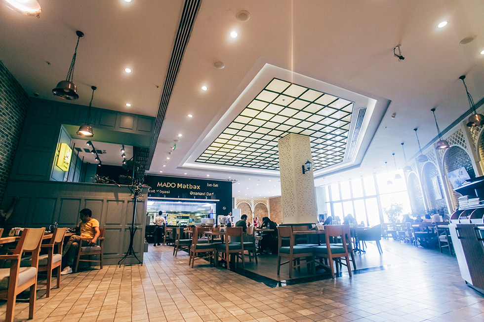 Food court seating and dining options at Ganjlik Mall