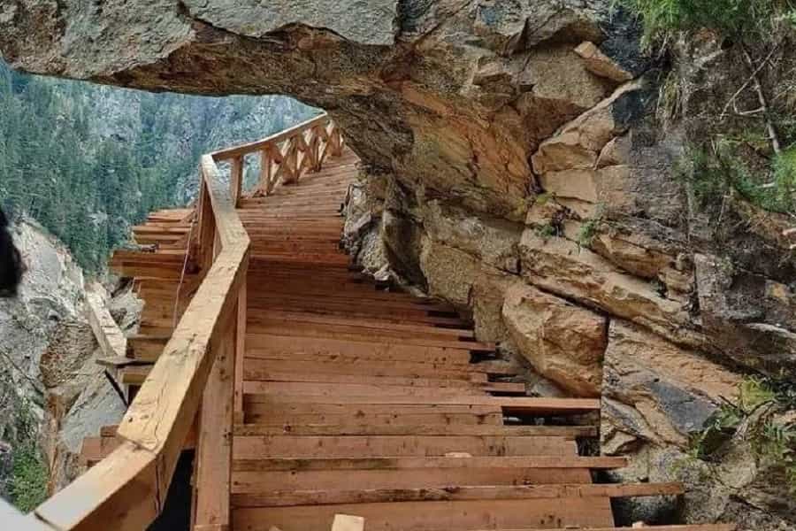 Gartang Gali wooden bridge along cliff face in Uttarakhand