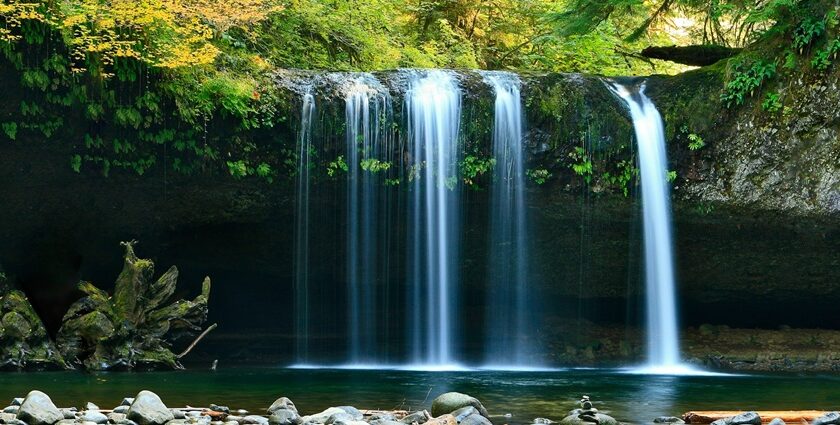 Photographer capturing Gitgit Waterfall with long exposure technique