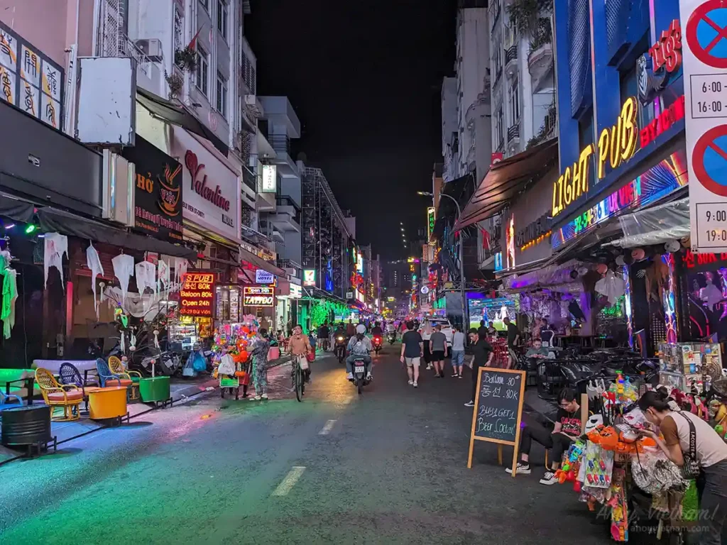 Nightlife district in Ho Chi Minh City with bars and neon lights