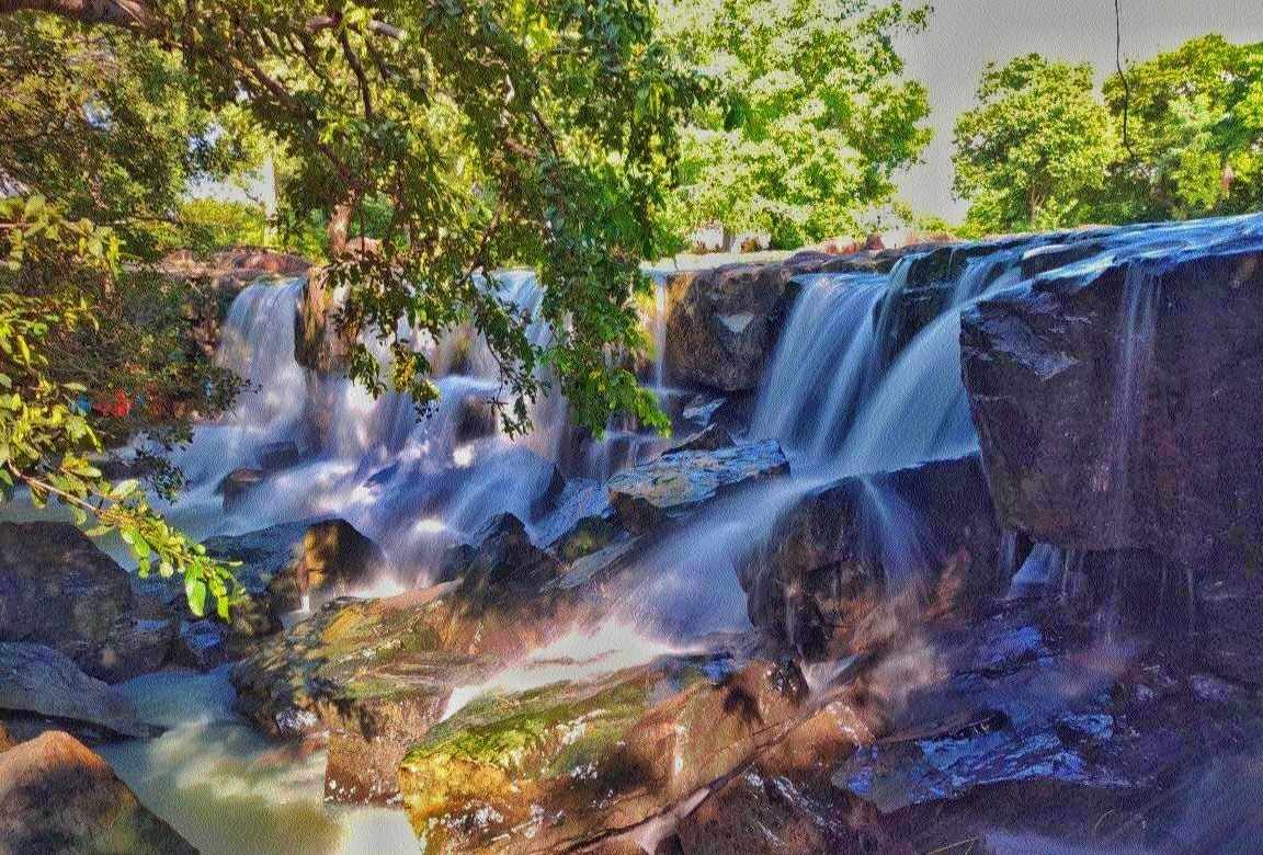 Hajra Waterfall in Chhattisgarh surrounded by forest cliffs