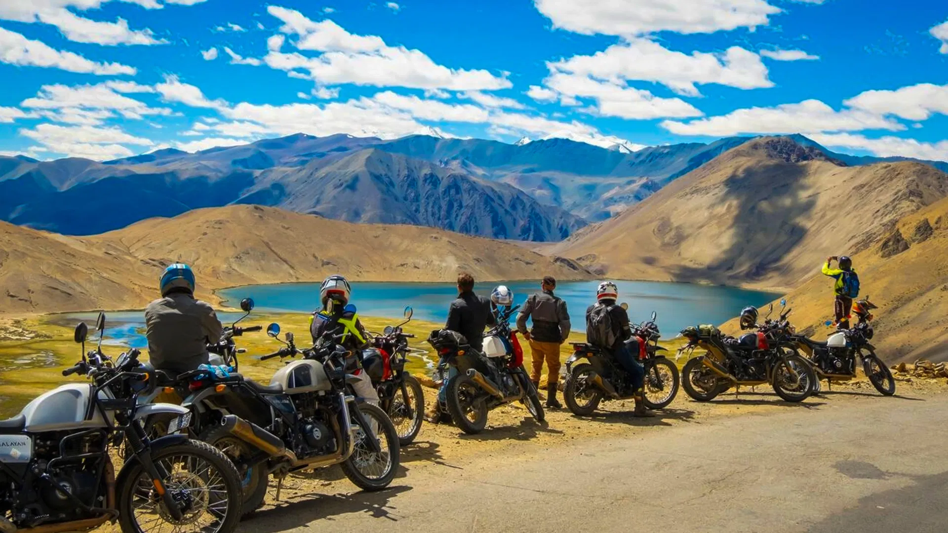 Motorcycle parked near an ancient monastery in Ladakh mountains