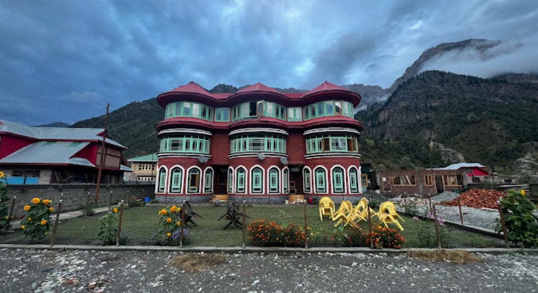 Mountain valley view with accommodation clusters in Gurez