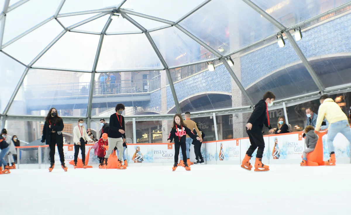 People ice skating at a rink in Delhi