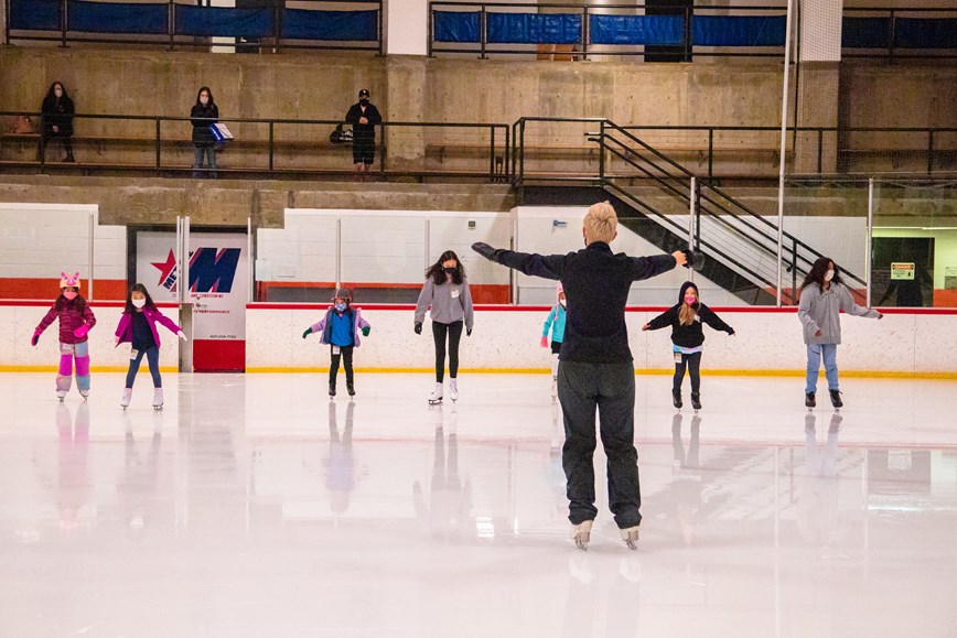 Instructor teaching ice skating to beginners in Delhi