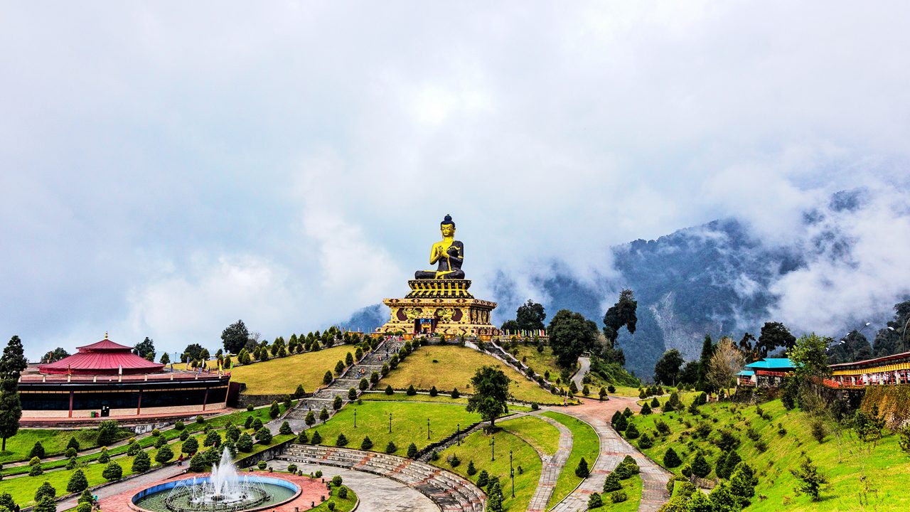 Kalimpong hillside town view with layered mountains and pine trees