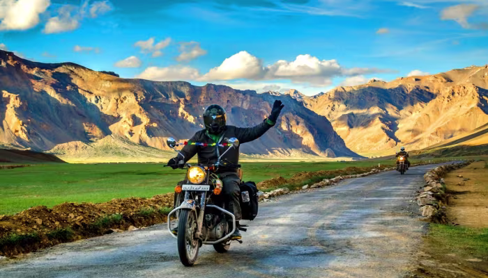 Rider on Leh to Kargil highway with mountain backdrop
