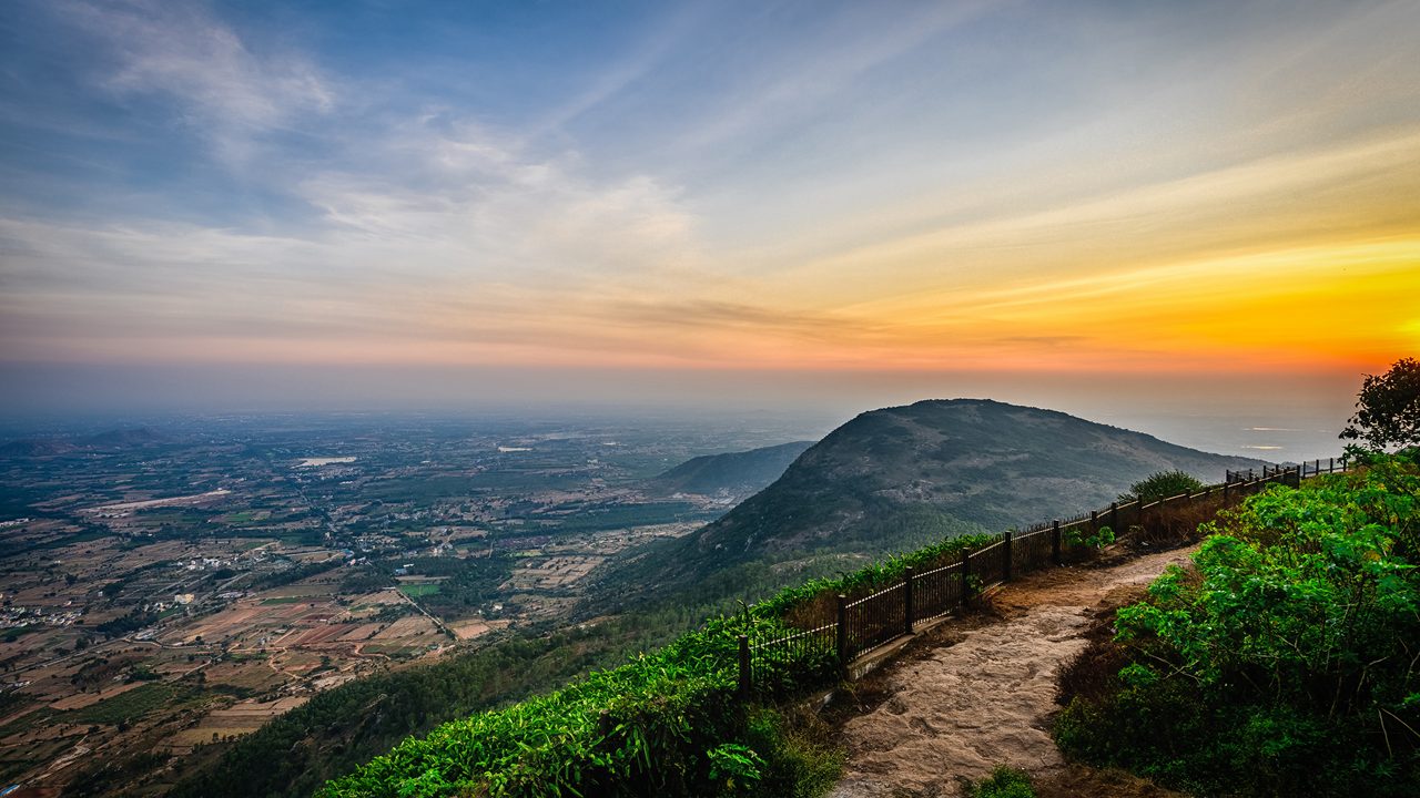 Nandi Hills at sunrise with misty valleys
