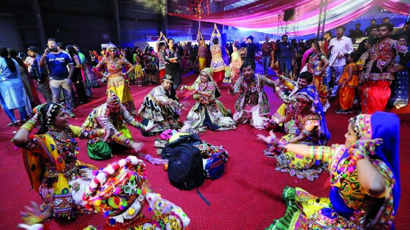Nesco Garba Mumbai dance floor with colorful Navratri lights and crowd