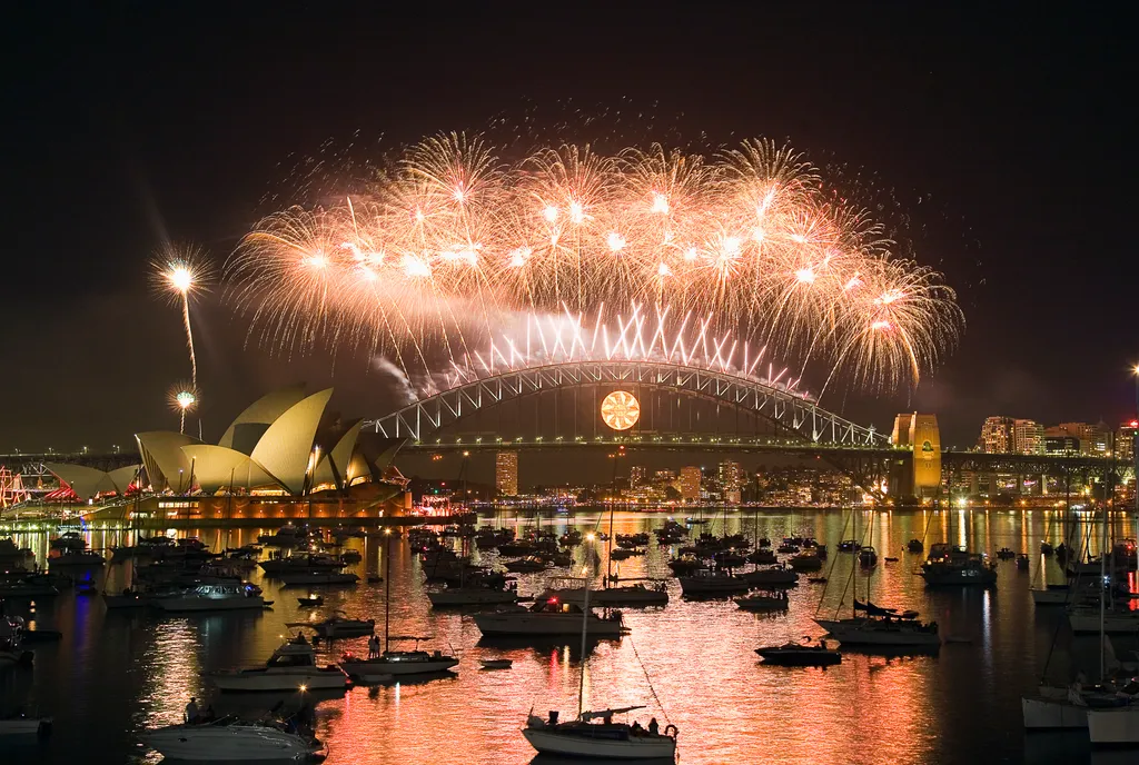 Global New Year fireworks and city skylines celebrating midnight