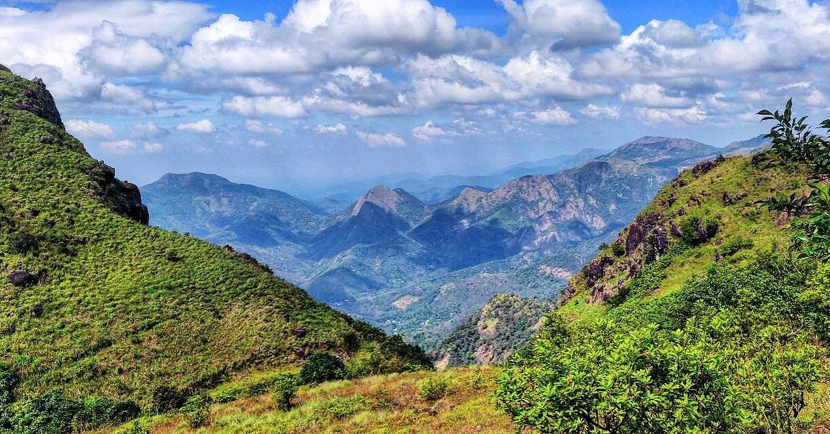 Rolling green hills of Vagamon with mist-covered valleys