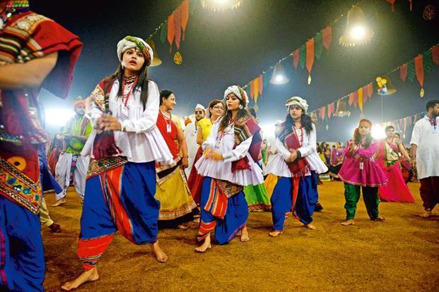 Navratri dancers in traditional Gujarati attire during Garba night