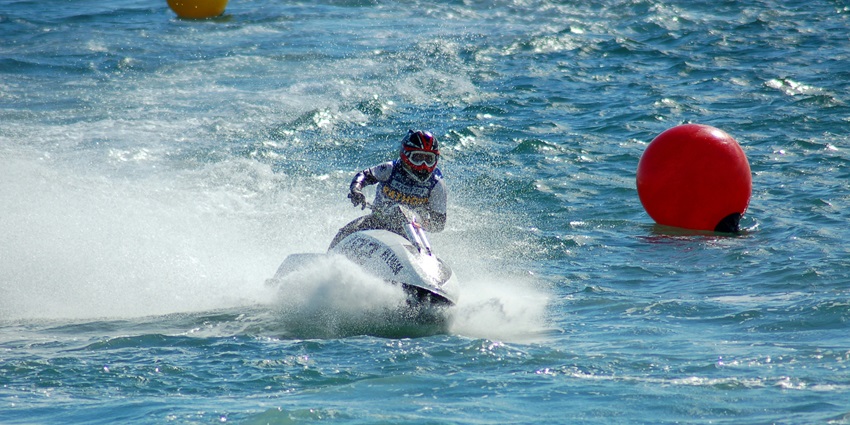 Water sports activities on Diu beach with jet skis and banana boats