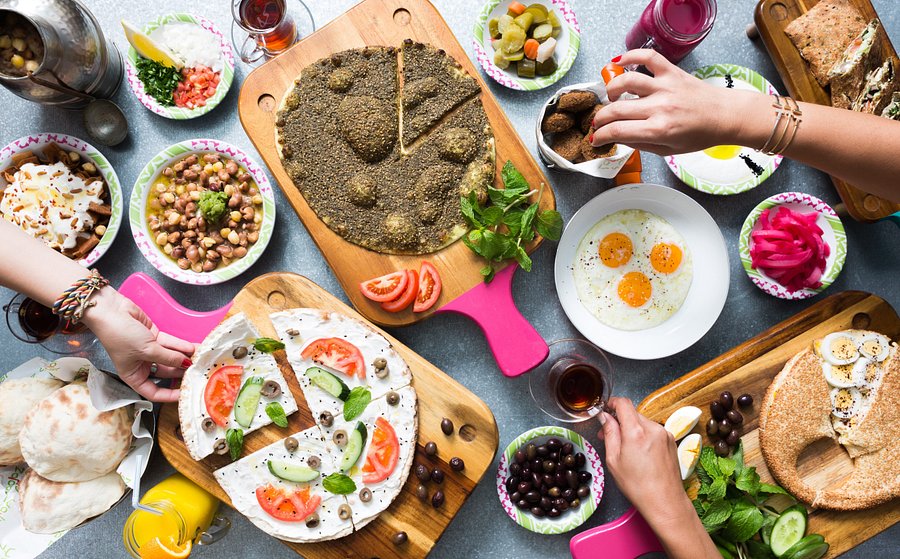 Levantine mezze spread with hummus, moutabal, and salads at Zaroob