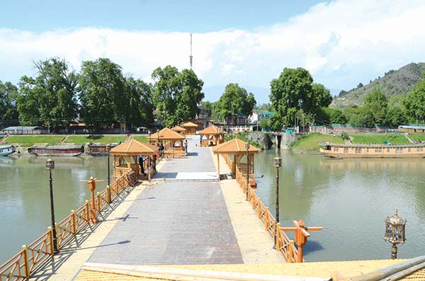 Zero Bridge Srinagar in summer with clear blue skies and lush greenery